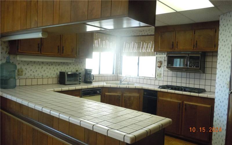 Another view of the kitchen.  The corner sink looks out to the rear enclosed patio...and beyond.