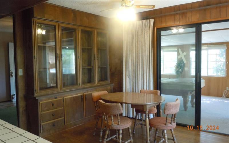 Dining area just next to the kitchen, with built-in display cabinet.