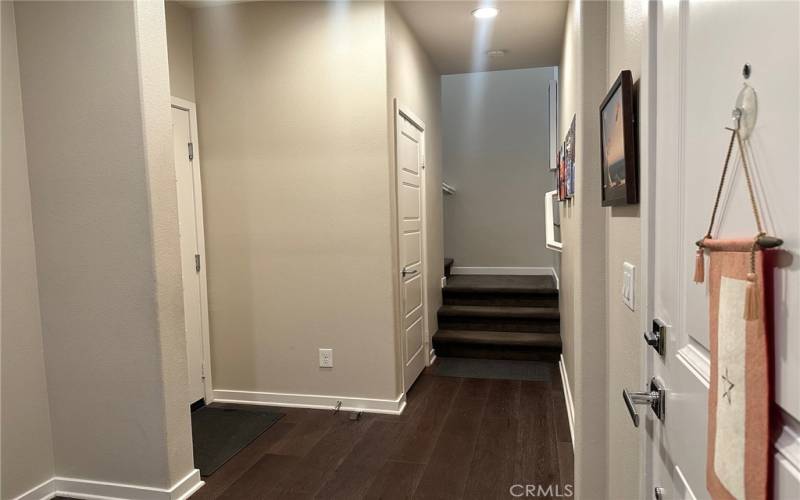 Direct access to your private 2 car garage & stairway up to your home