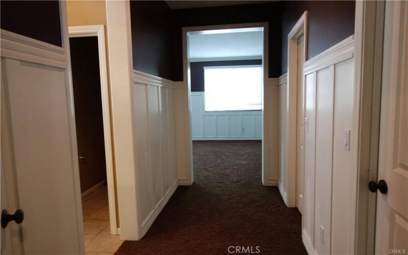 Main bedroom hallway goes to right side walk in closet and left side bathroom