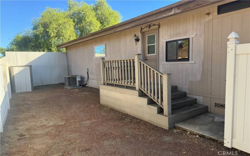 Back entrance to Laundry Room and Enclosed Yard