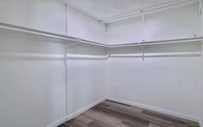 Have a space for everything and everything in it's space with this spacious walk-in closet