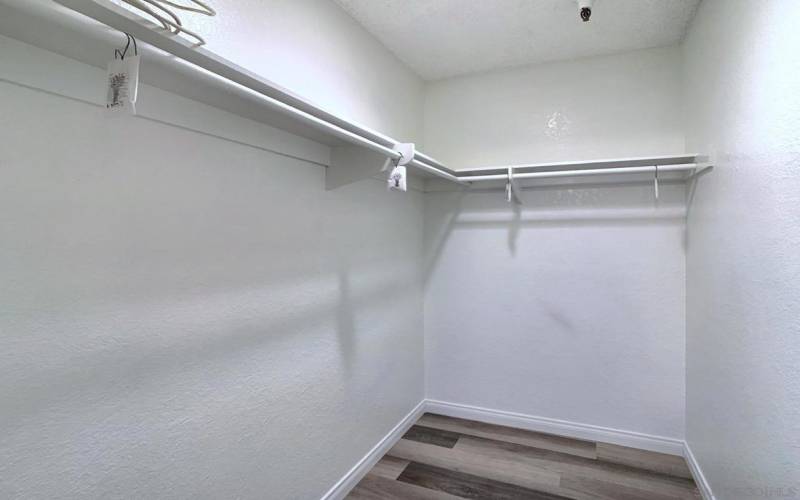 Spacious walk-in closet offers ample storage, better organization, and a luxurious, clutter-free living experience.