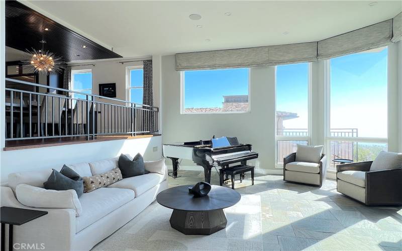 Living room to the right of the main entrance with amazing ocean view.