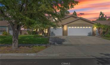 A beautiful two-story home, featuring manicured landscaping and dual garages, located in a phenomenal neighborhood.