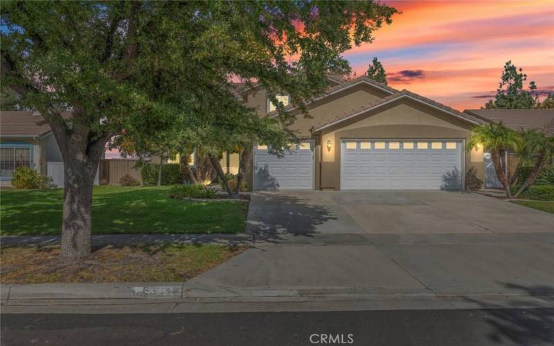 A beautiful two-story home, featuring manicured landscaping and dual garages, located in a phenomenal neighborhood.