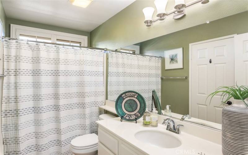 This well-appointed second bathroom offers convenience and privacy, enhancing the home’s overall functionality and comfort.