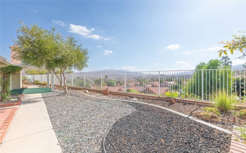 Tranquil backyard with low-maintenance landscaping and panoramic views, perfect for relaxation and outdoor enjoyment.