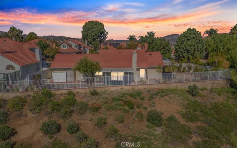 Beautiful single-story home featuring an open backyard with scenic views.