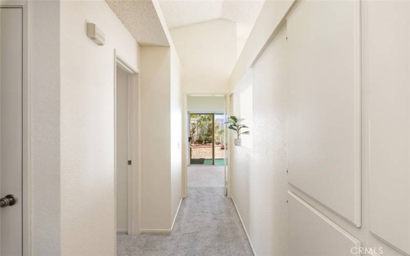 Bright hallway with built-in storage cabinets, offering convenient organization and easy access.