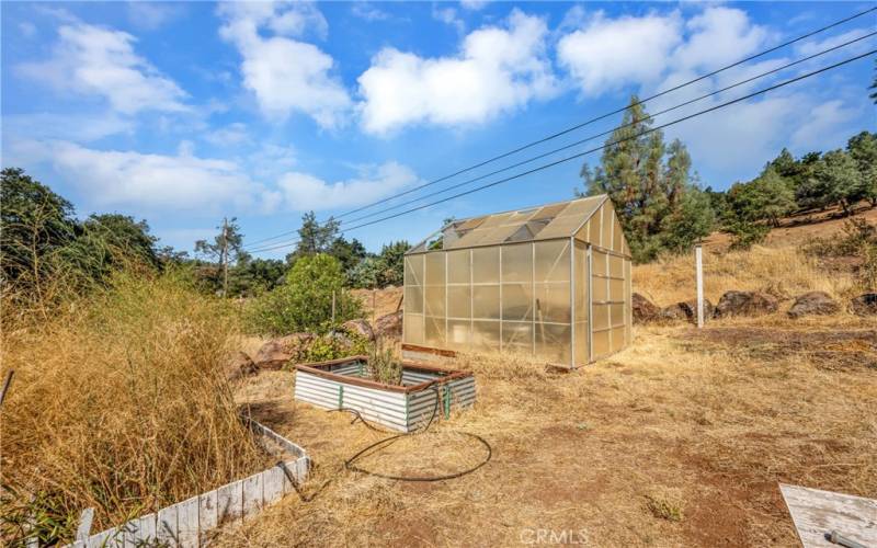 10' x 12' x 10' Greenhouse on concrete foundation.