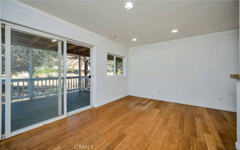 ADU living area with bamboo flooring and slider to its own private deck.