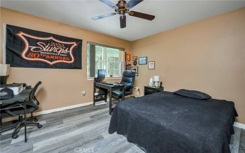 New gray luxury vinyl flooring in bedroom 2.