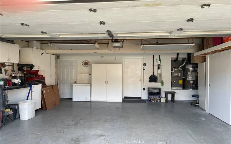 Garage with entry to house and side yard