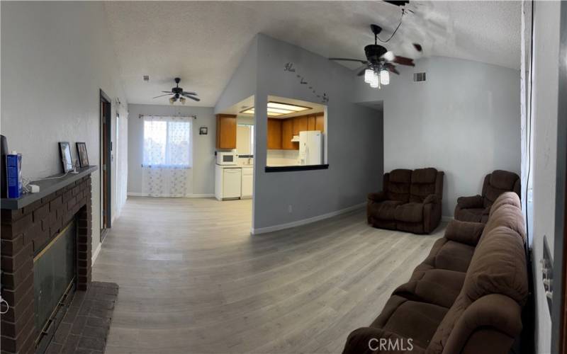 Front entrance view of living room and kitchen area