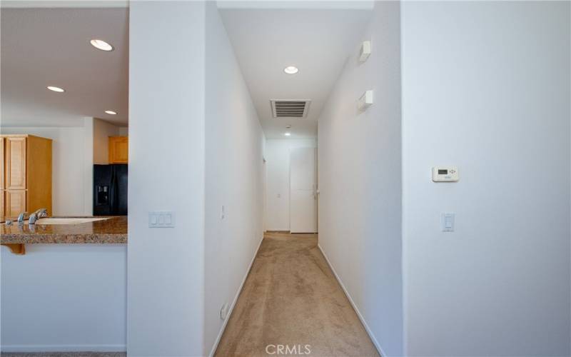 Hall to the bedrooms with a big linen closet at the end.