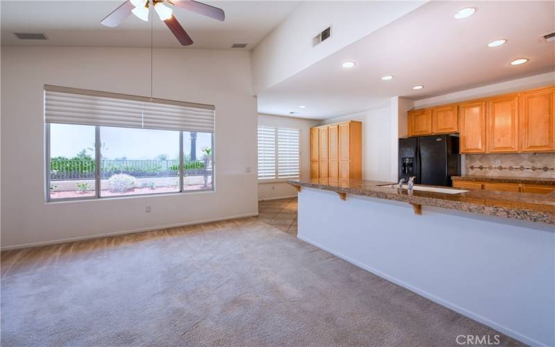 Panoramic views from the family room, kitchen and dinette with plantation shutters and a huge pantry.