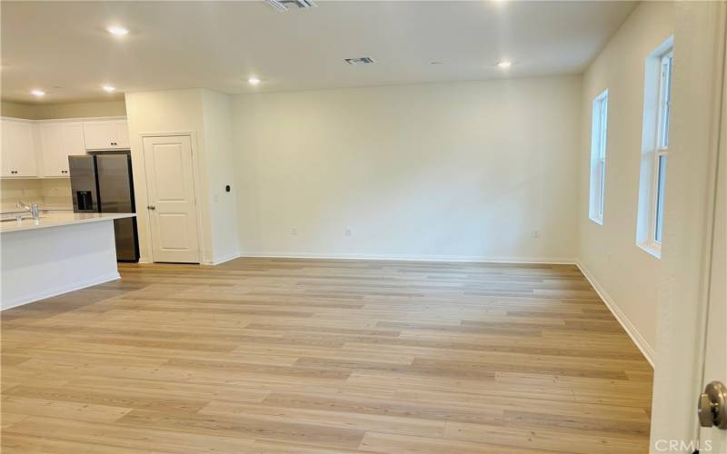 Large living room with wood flooring