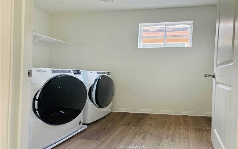 side by side washer dryer upstairs.