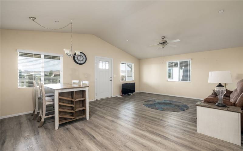 Living room and breakfast nook looking towards the golf course and lake