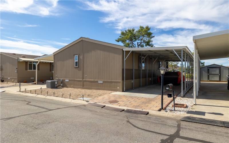 View of the carport, extra long can fit 3 cars!