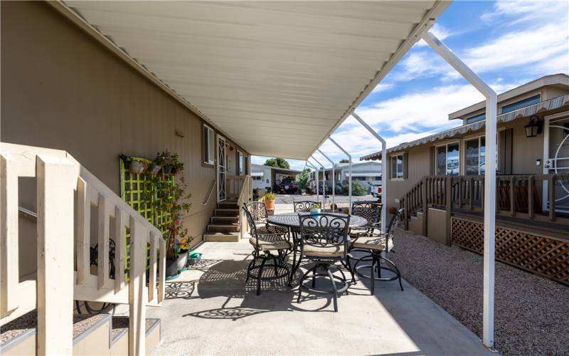 Steps to the porch and side door on patio side