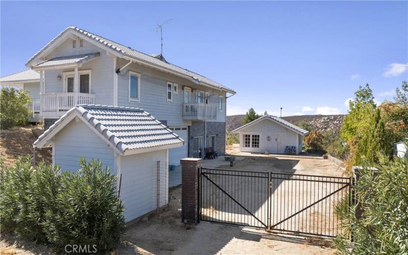 The lower gate has direct access to lower areas of the property and the detached ADU.