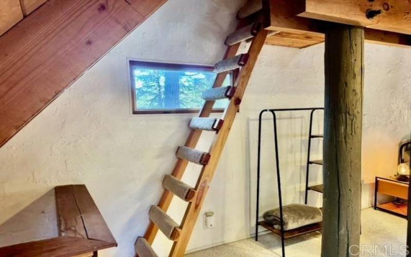 Climb the ladder to the loft... great for all kinds of projects or a office-with-a-view.