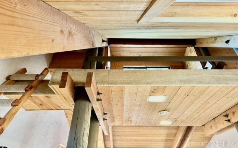 The living room vents above the wood stove to the bedroom, then up to the loft.