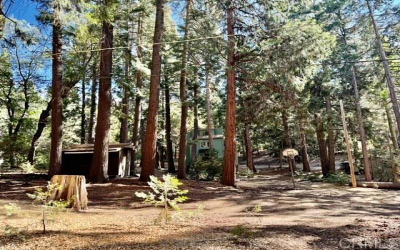 Nearly 3/4 of an acre with the cabin, walk-out storage under cabin and a nice equiment shed.