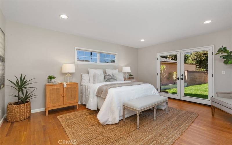 Main Bedroom with French Door Walk Out to backyard, En Suite and walk in closet