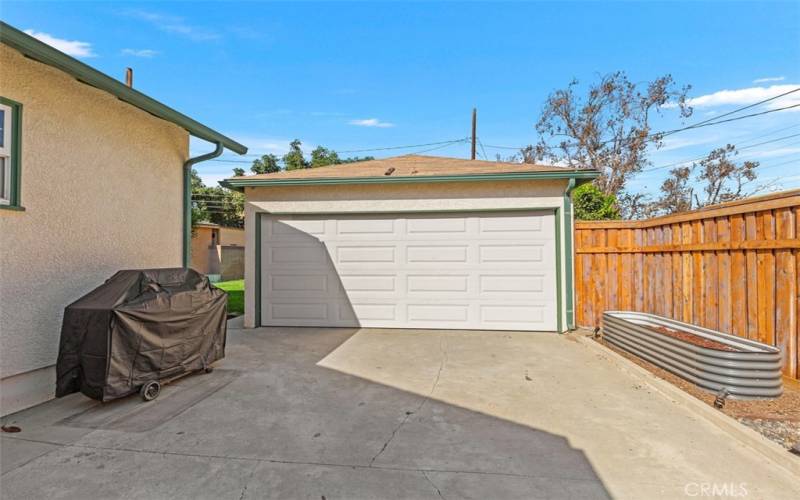 Backyard with 2 Car Garage and additional large storage shed all behind a private gate fence