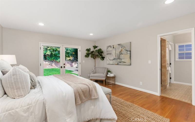 Main Bedroom with French Door Walk Out to backyard, En Suite and walk in closet