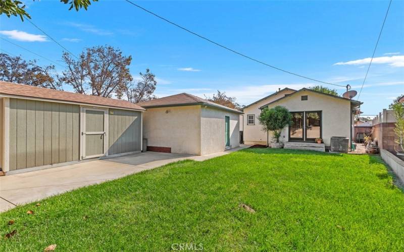 Backyard with 2 Car Garage and additional large storage shed all behind a private gate fence