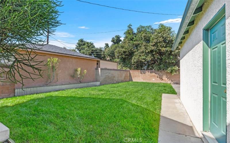 Backyard with 2 Car Garage and additional large storage shed all behind a private gate fence