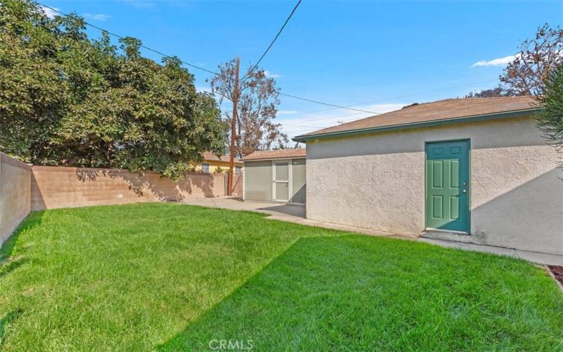 Backyard with 2 Car Garage and additional large storage shed all behind a private gate fence