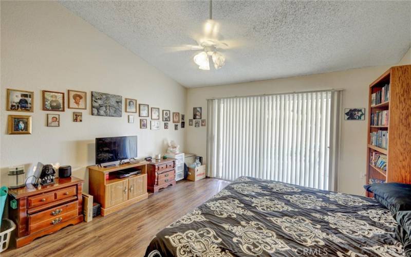 Sliding glass door to patio from primary bedroom.