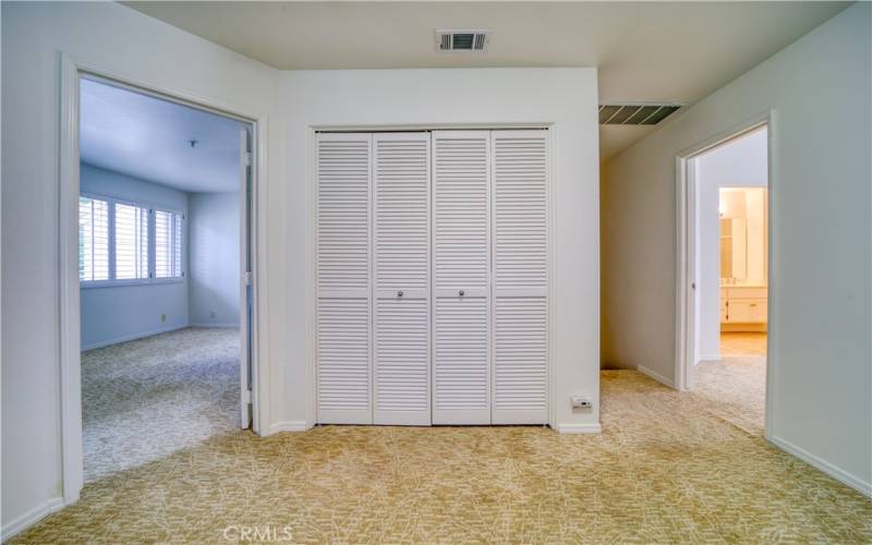 Den with laundry closet