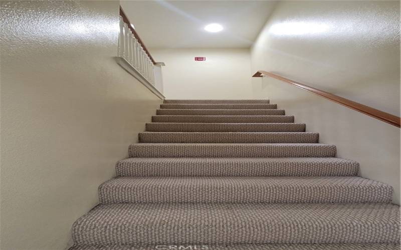 Staircase to the second floor to bedrooms.