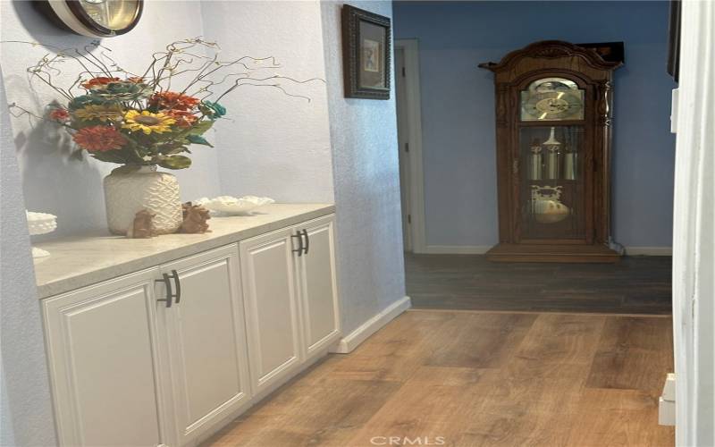 Hallway with quartz countertop and cabinets