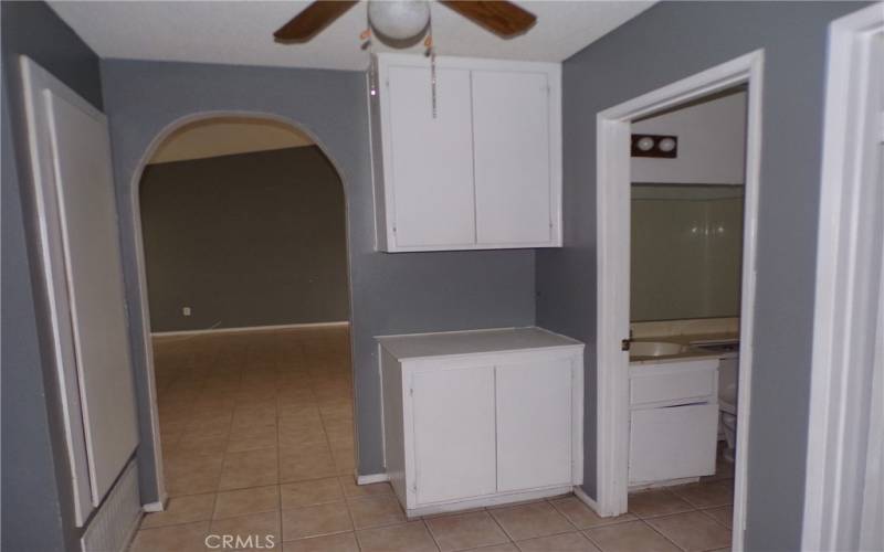 Hall area toward livingroom with hall full bath on right