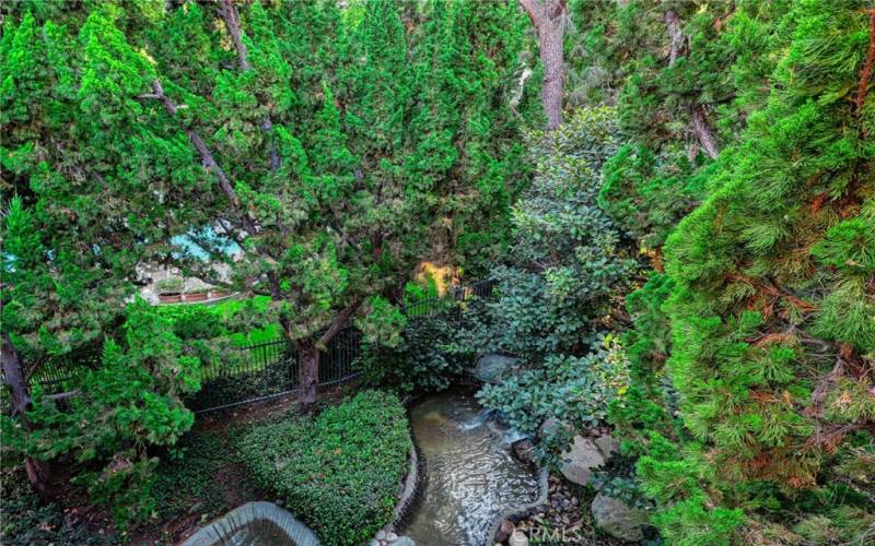 Listen to the sounds of rushing water outside your patio door with a beautiful waterfall below.