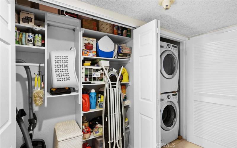 Here you see the spacious storage closet for large items like vacuum cleaner, brooms, mops etc.