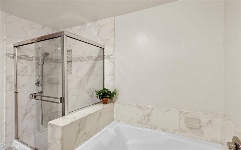 Separate shower and bath.  Same materials used in hall bath for a beautiful flow within the home.