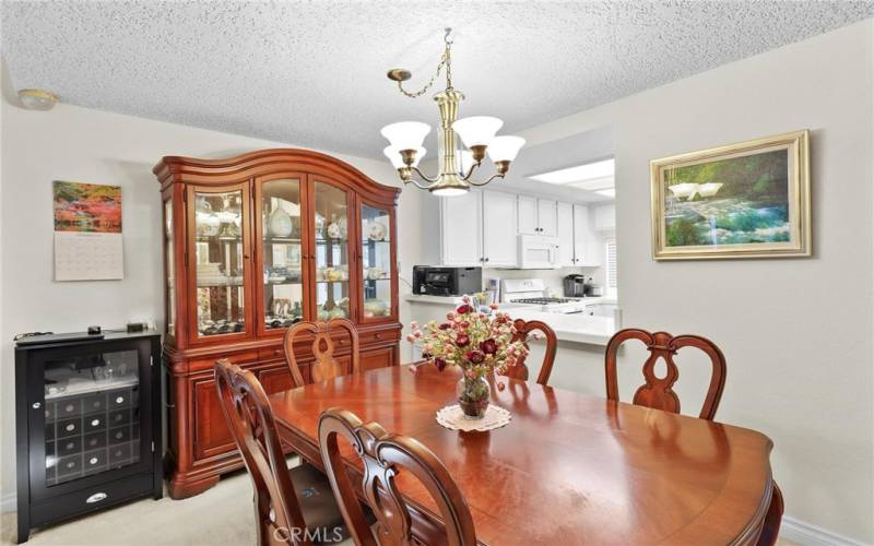 Here you can see the open concept between kitchen and dining flowing through to living room