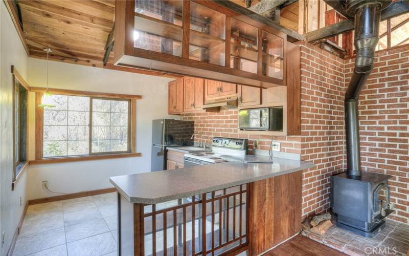 Kitchen area with custom cabinets in view