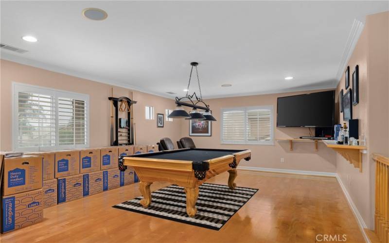 Contemporary flooring, plantation shutters in the game room