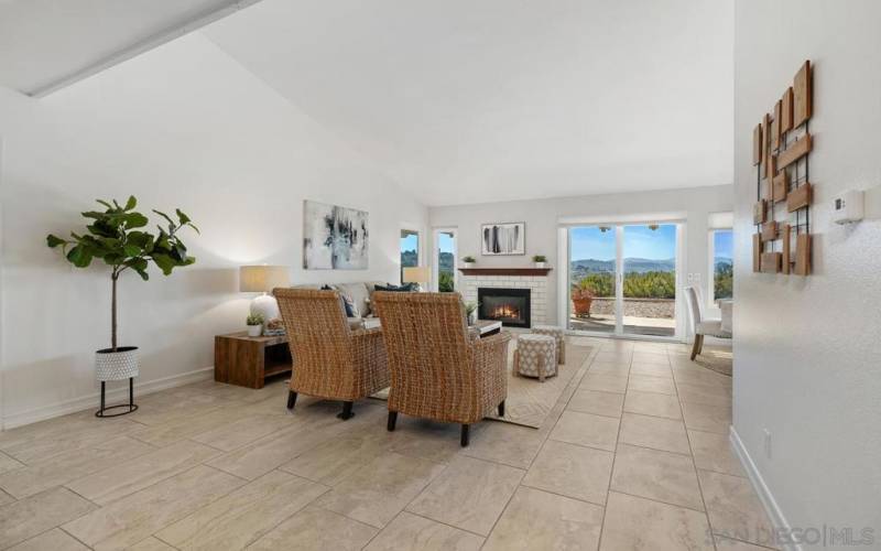 Living Room features vaulted ceilings and cozy gas fireplace.