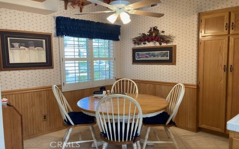 Casual eating nook in the kitchen.  Shutters in all rooms.