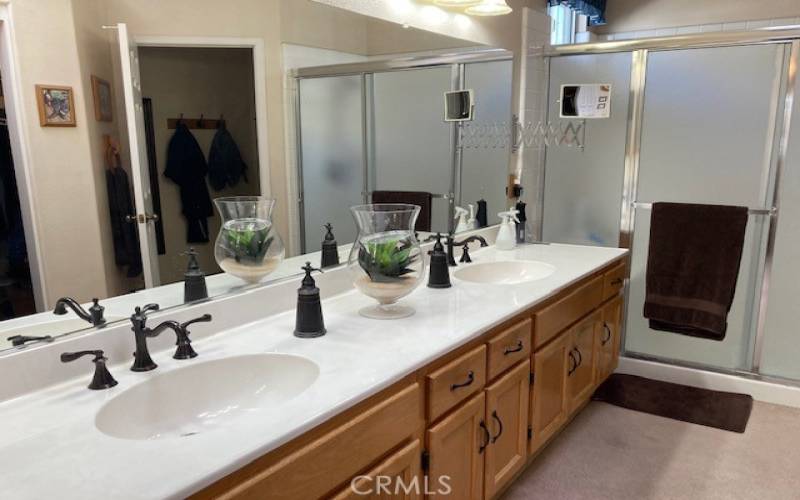 Primary bath has dual sinks and updated fixtures.